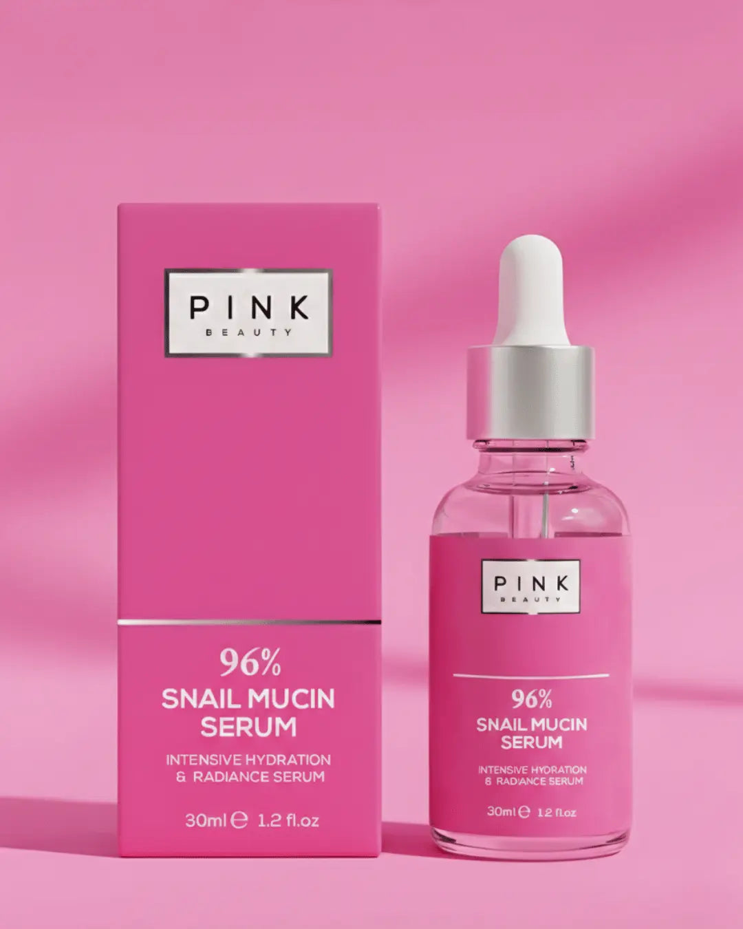 Pink Beauty 96% Snail mucin serum bottle and packaging on a pink background