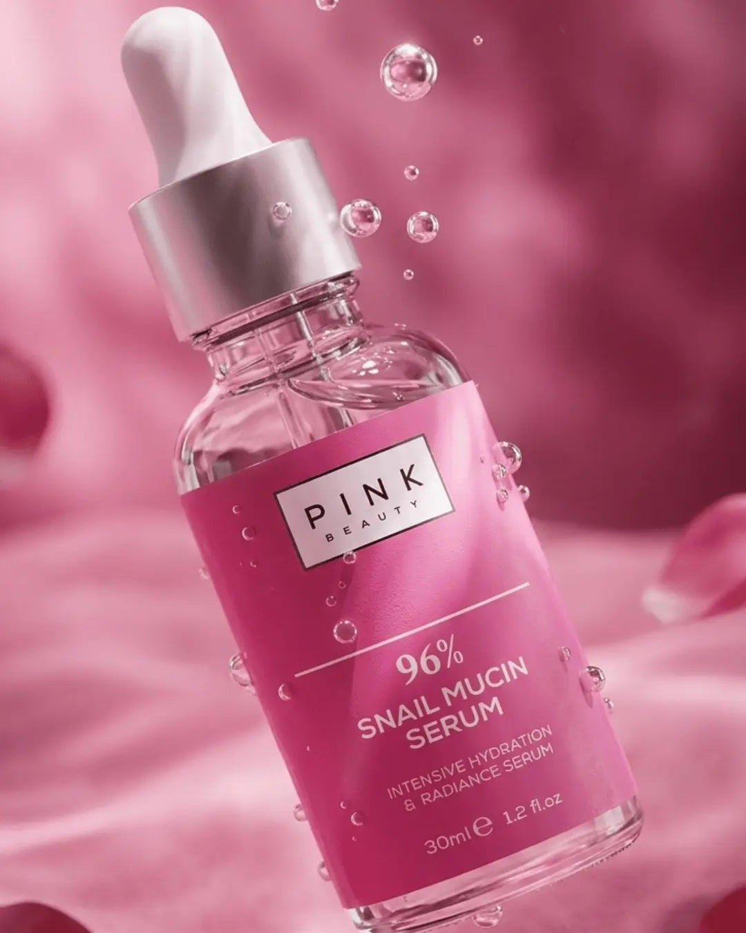 Pink Beauty 96% Snail Mucin serum bottle with dropper on a pink background