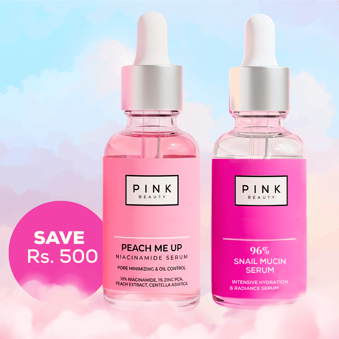 Two Pink Beauty serum dropper bottles shown side by side against a pastel sky background with clouds. The left bottle contains pink liquid and is labeled 'PEACH ME UP MIACINAMIDE SERUM'; the right bottle is clear with bright pink liquid and is labeled '96% SNAIL MUCIN SERUM'.